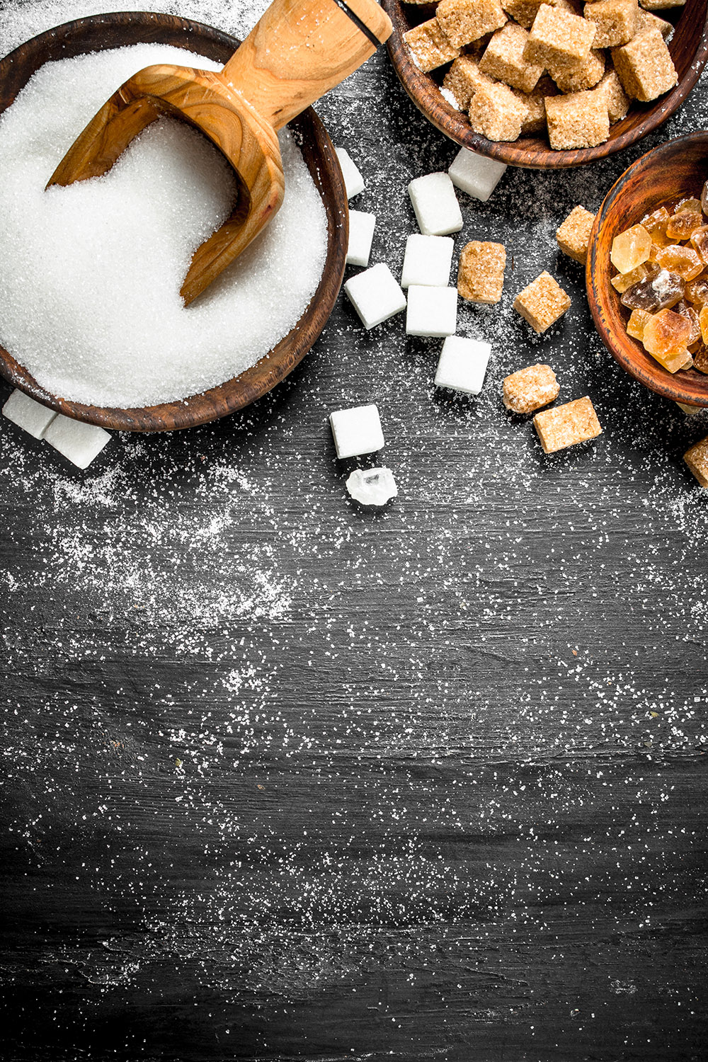 Different sugar with bowls.