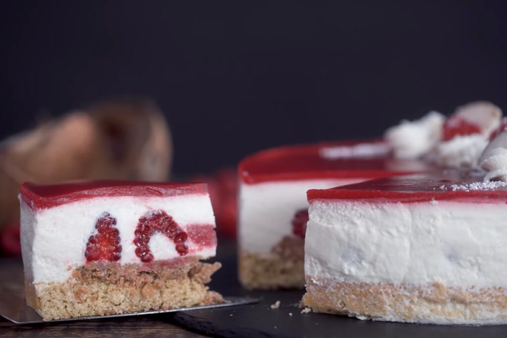 Raspberry Coconut Mousse Cake cutting